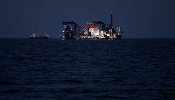 The Artemis dredger operated by Van Oord sits anchored as the traffic is down in the Strait of Hormuz, amid the U.S.-Israeli conflict with Iran, in Muscat, Oman, March 10, 2026. — Reuters