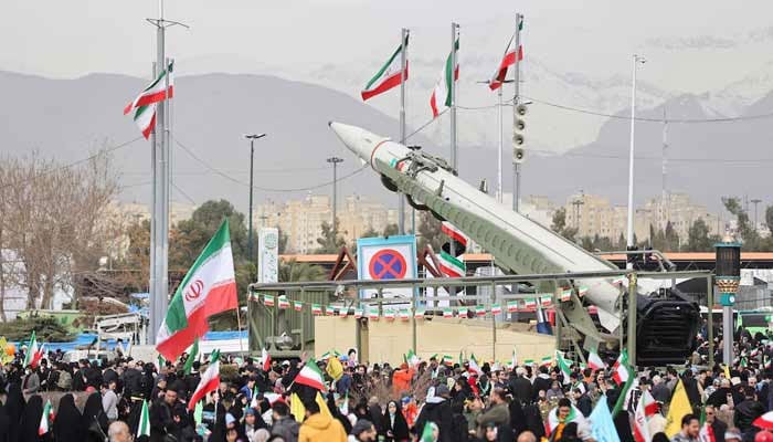 People gather near a missile on display during the 47th anniversary of the Islamic Revolution in Tehran, Iran February 11, 2026.— Reuters