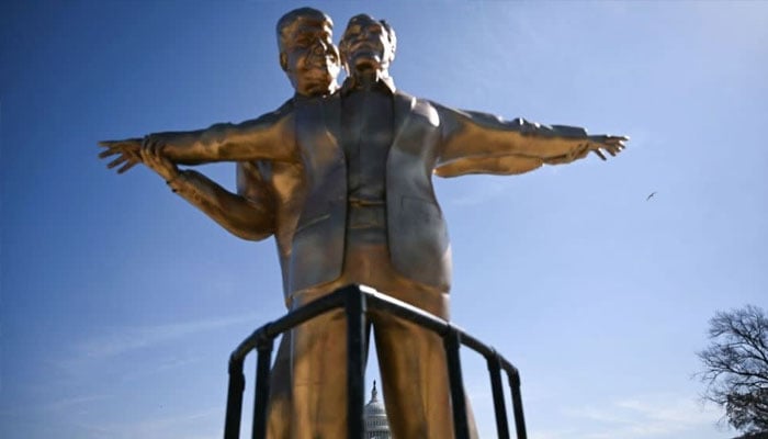 The statue of US President Donald Trump and the disgraced financier Jeffrey Epstein. —AFP/File