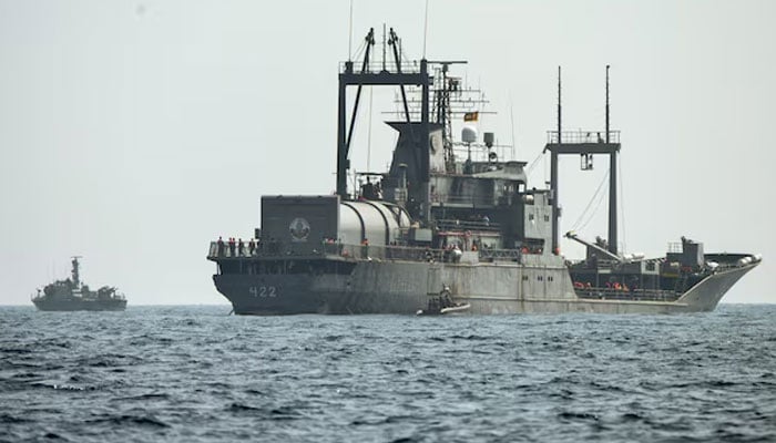 A Sri Lanka Navy vessel approaches an Iranian vessel during a rescue operation, a day after the crew of a distressed Iranian military ship, IRIS Dena were assisted in waters south of Sri Lanka, off the coast of Colombo, Sri Lanka March 5, 2026.—Reuters
