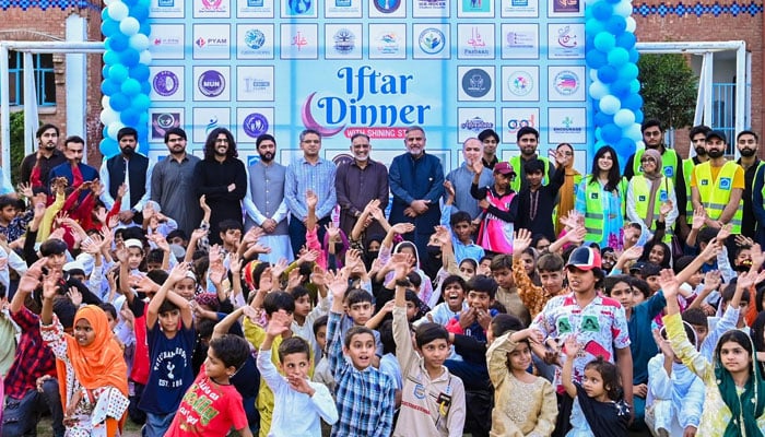 AKF Secretary General Syed Waqas Jaffery (centre), in a group photo with children during an Iftar dinner and Eid Mela for children of the Alkhidmat Child Protection Centre on March 12, 2026. — Facebook@alkhidmat.org