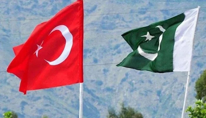 This image displays the national flags of Turkiye and Pakistan flying together. —TheNews/File