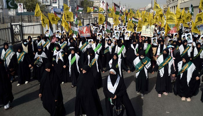Participants hold a protest rally against the USA and Israel as they mark Youm-ul-Quds to show solidarity with the people of Palestine on M.A Jinnah Road in Karachi on March 13, 2026. — PPI