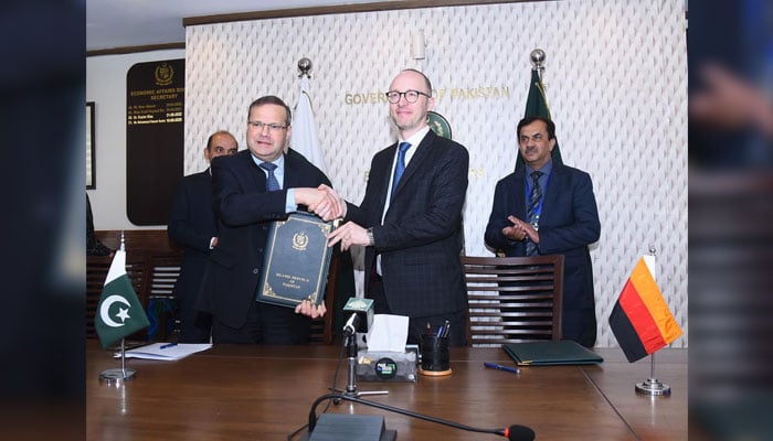Secretary Economic Affairs Division, Muhammad Humair Karim and Sebastian Jacobi, Country Director of the German Government Bank for Development (KfW), shaking hands after signing a grant agreement on March 13, 2026. — APP