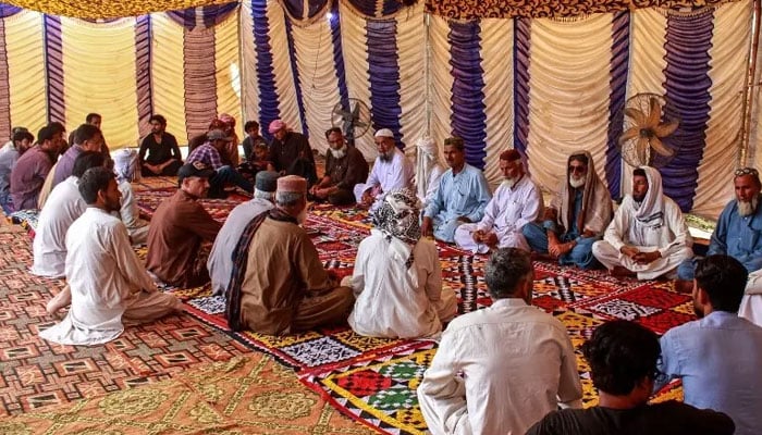 Mourners gather to offer condolences after the death of Pakistani national Muzaffar Ali, who was killed in Dubai amid the ongoing Middle East war, after his funeral in Jamshoro in Sindh province on March 12. — AFP