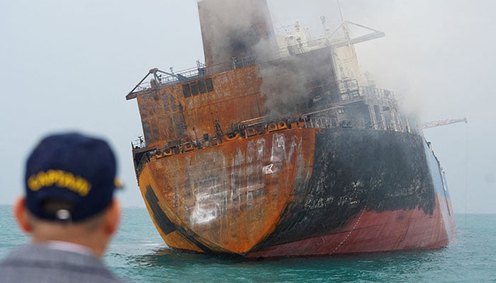 A foreign tanker carrying Iraqi fuel oil damaged after catching fire in Iraqs territorial waters, following unidentified attacks that targeted two foreign tankers, according to Iraqi port officials, near Basra, Iraq, March 12, 2026. — Reuters