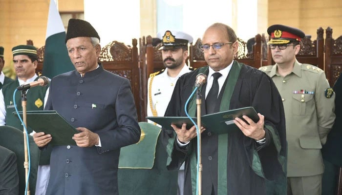 Chief Justice Zafar Ahmed Rajput administers the oath to Syed Muhammad Nehal Hashmi as Governor of Sindh at the Governors House on March 13, 2026. — APP
