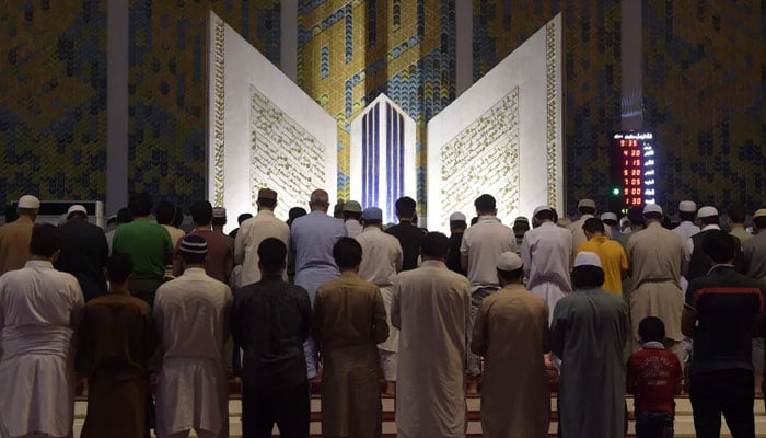 Pakistani Muslims attend a special Taraweeh evening prayer on the first day of the Muslim fasting month of Ramazan at the Grand Faisal Mosque in Islamabad, Pakistan, May 16, 2018.— AFP