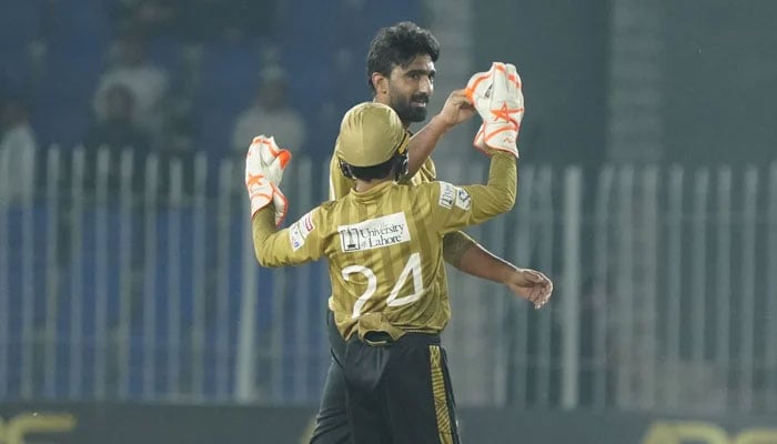 Sialkots Usama Mir (right) celebrates taking a wicket with teammate during their National T20 Cup match against Abbottabad at the Imran Khan Cricket Stadium in Peshawar on March 14, 2026. — PCB