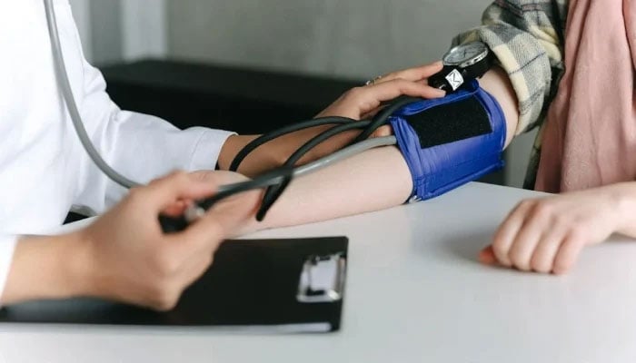 This representational image shows a doctor checking a patients blood pressure. — Pexels/File