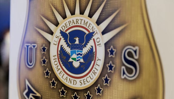 The seal of the US Department of Homeland Security is printed on a sign during a US Immigration and Customs Enforcement (ICE) two-day job fair in Texas to help fill vacancies for deportation officers and attorneys, in Arlington, Texas, US August 26, 2025. —Reuters