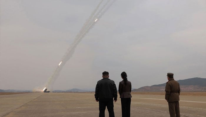 This picture taken on March 14, 2026 and released by North Koreas official Korean Central News Agency (KCNA) via KNS on March 15, 2026 shows North Korean leader Kim Jong Un and his daughter Kim Ju Ae observing a training exercise of North Korean Armys 600mm-calibre ultra-precision multiple rocket launchers, at an undisclosed location in North Korea. —AFP