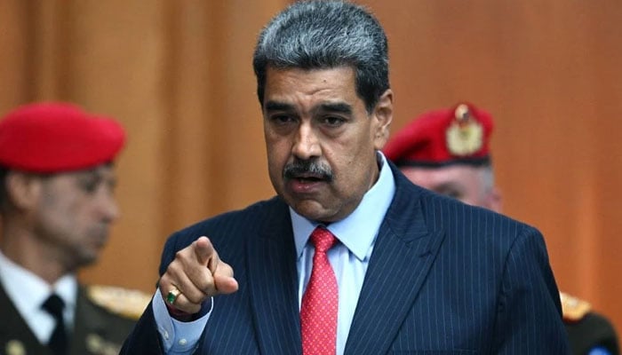 Venezuelan President Nicolas Maduro gestures as he leaves a press conference to the international media about the presidential election at the Miraflores presidential palace in Caracas. — AFP/File