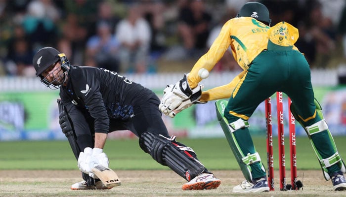 New Zealand’s Devon Conway (left) plays a shot. —AFP/File