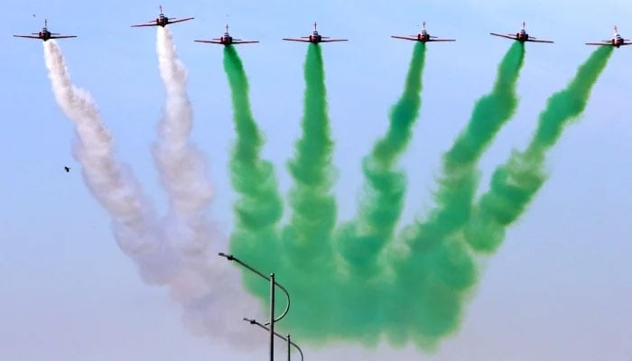 Pakistan Air Force (PAF)’s Sherdils team perform aerobatic maneuver during the Pakistan Day Parade as they fly past near the Presidents House, Islamabad, March 23, 2025. —INP