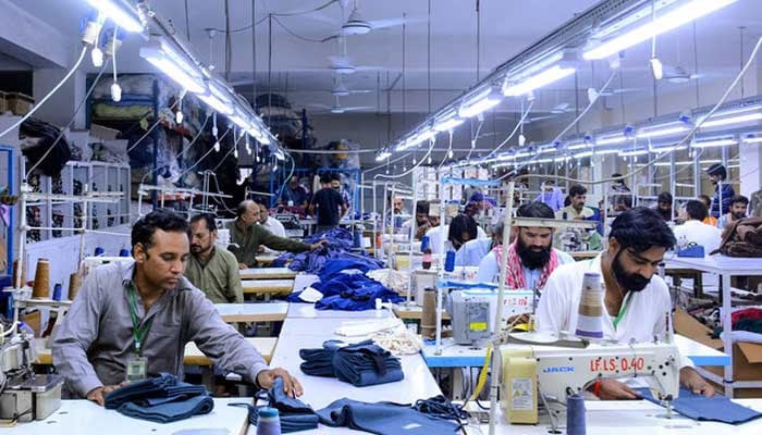 Tailors work at a garment factory in Faisalabad on June 13, 2024. — AFP/File