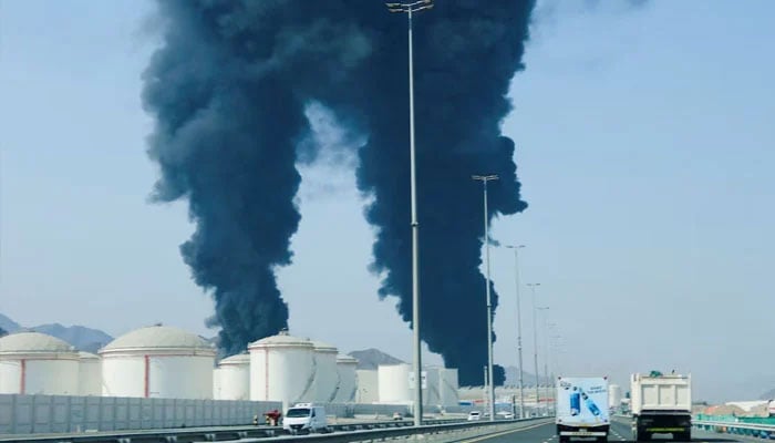 Smoke rises in the Fujairah oil industry zone, caused by debris after interception of a drone by air defences, according to the Fujairah media office, amid the US-Israel conflict with Iran, in Fujairah, United Arab Emirates, March 14, 2026.—Reuters