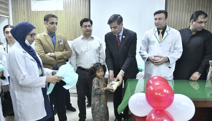 Ameer-ud-Din Medical College Principal, Prof Dr Farooq Afzal, distributes Eid gifts among children suffering from thalassemia at Lahore General Hospital (LGH) on March 18, 2026. — Facebook@lghlahore