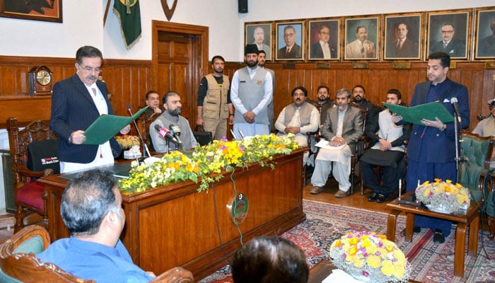 Governor Balochistan Jaffar Khan Jamali administers the oath to Ziaullah Langov as Balochistan Home Minister at the Governors House on March 18, 2026. — APP