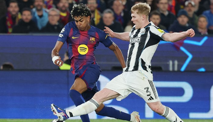 Barcelonas Spanish forward #10 Lamine Yamal and Newcastle Uniteds English midfielder #03 Lewis Hall fight for the ball during the UEFA Champions League last 16 second leg football match between FC Barcelona and Newcastle United at the Camp Nou stadium in Barcelona, on March 18, 2026.  — AFP