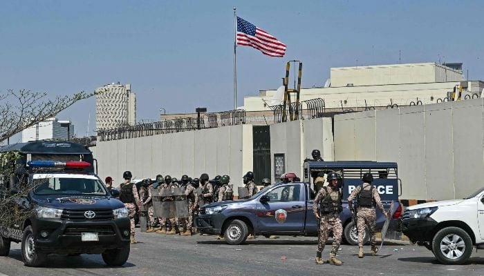 Security personnel stand guard outside the US consulate in Karachi on March 1, 2026. — AFP