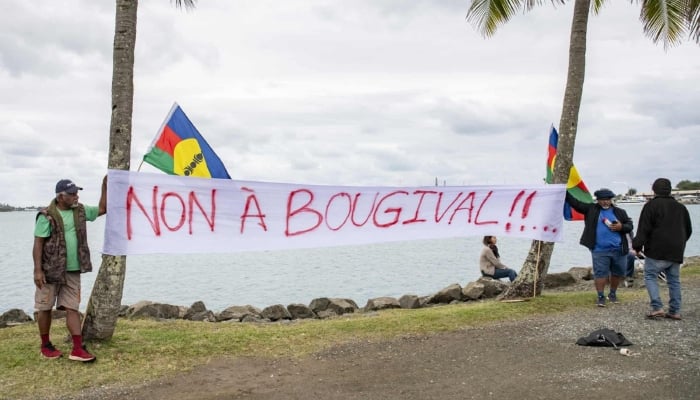 Activists display a banner reading “No to Bougival” along the road to the Customary Senate in Noumea, 20 August 2025. —AFP