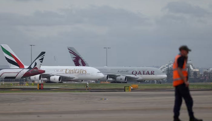 Emirates and Qatar Airways planes sit on the tarmac at Sydney Kingsford Smith Airport in Sydney, Australia, March 3, 2026.—Reuters