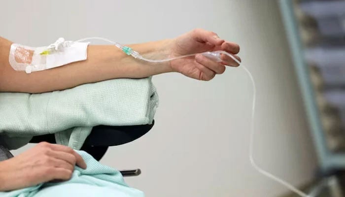 A cancer patient receives a tracer injection. — Reuters/File