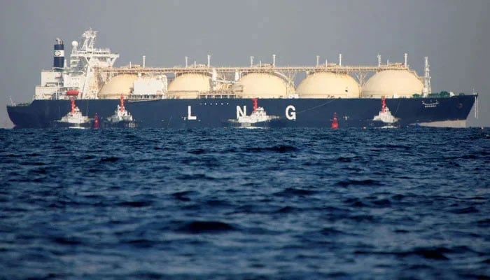 A liquefied natural gas (LNG) tanker is tugged towards a thermal power station. — Reuters/File