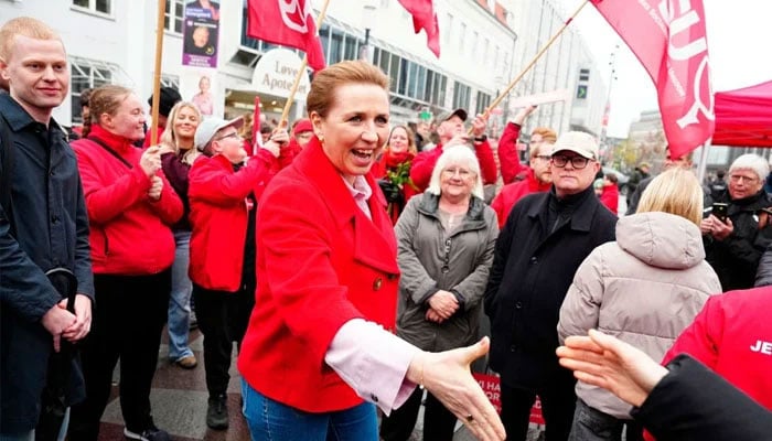 The leader of Denmarks Social Democrats, Mette Frederiksen, greets wellwishers on the street at Nytorv in Aalborg, on March 24, 2026 during the parliamentary election in Denmark. —AFP