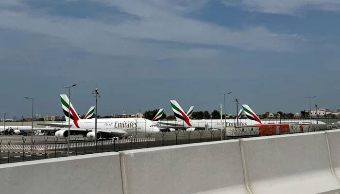 Emirates planes sit on the tarmac of Dubai International Airport (DXB) after two drones came down in the vicinity of the airport, amid the US-Israeli conflict with Iran, in Dubai, United Arab Emirates, March 11, 2026.—Reuters