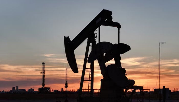 A drone view of a pump jack and drilling rig south of Midland, Texas, US June 11, 2025.—Reuters