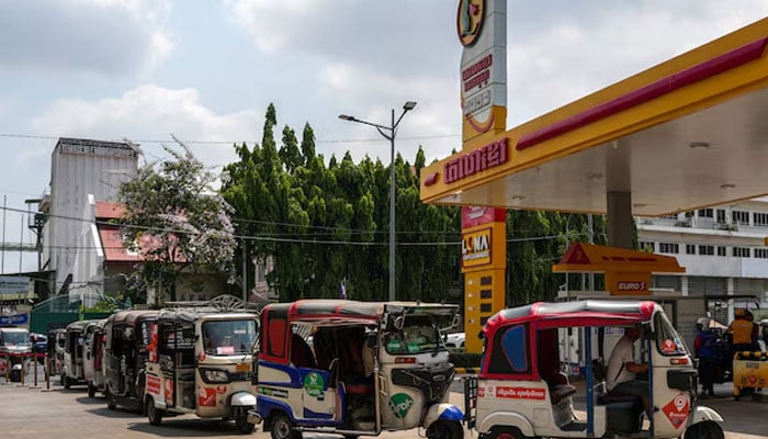 Tuk-tuks queue to fill LPG and gasoline at a gas station, amid the US-Israeli conflict with Iran, in Phnom Penh, Cambodia, March 24, 2026.—Reuters