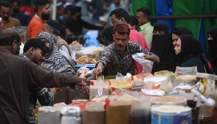 A vendor sells spice at a wholesale market in Karachi, on February 13, 2026. — INP