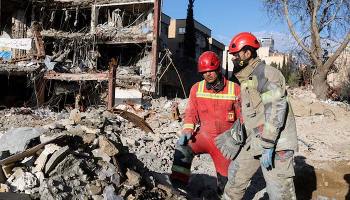 Members of a Red Crescent rescue team work at a building that was damaged by a strike, amid the US-Israeli conflict with Iran, in Tehran, Iran, March 21, 2026. — Reuters
