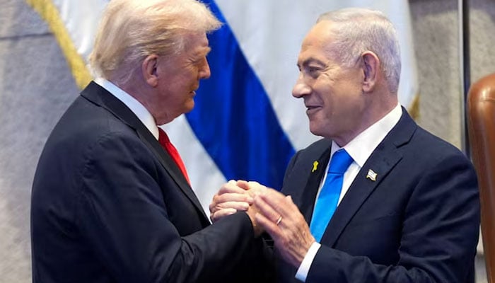 President Donald Trump talks with Israels Prime Minister Benjamin Netanyahu at the Knesset, Monday, Oct. 13, 2025, in Jerusalem. — Reuters