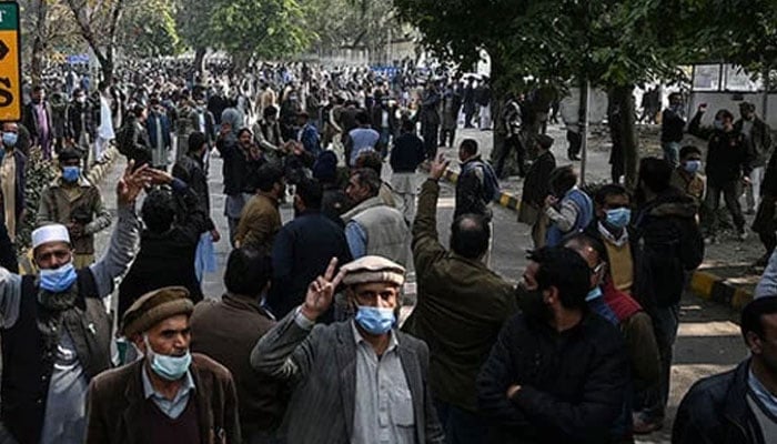 The representational image shows people holding a protest rally. — AFP/File
