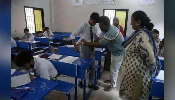 Students of matric class solving paper in examination centre on May 13, 2024. — PPI