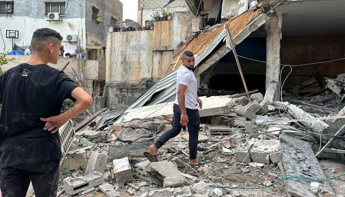 Palestinians check a damaged house following an Israeli raid in Tulkarm in the Israeli-occupied West Bank September 24, 2023. — Reuters