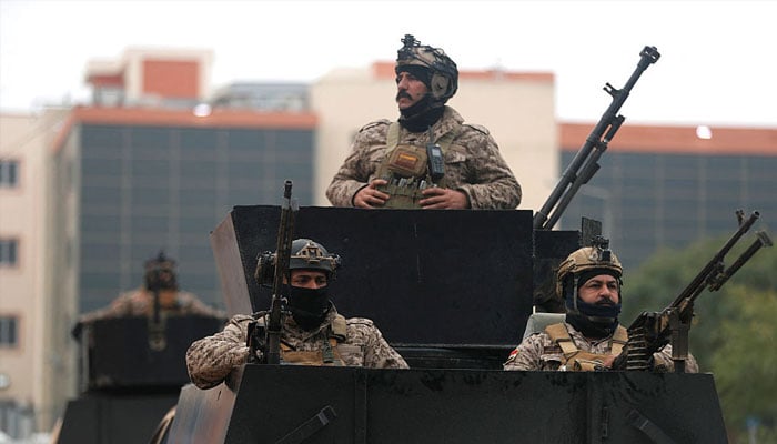 Iraqi security personnel in position. —AFP/File