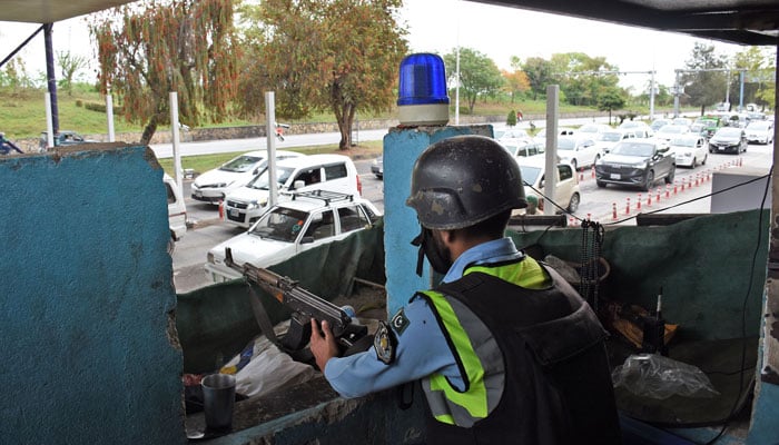 A police officer is standing alert in a bunker alongside a road due to a heightened security alert during Pakistans hosting of talks with Saudi Arabia, Turkey and Egypt to discuss regional de-escalation, amid the US-Israel conflict with Iran, in the Federal Capital on March 29, 2026. — Online