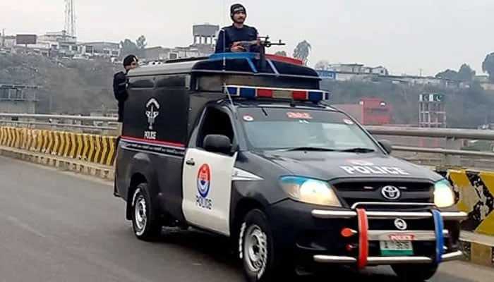 Police personnel patrol in a police vehicle in KP on February 4, 2024. — Facebook@KhyberPakhtunkhwaPolice