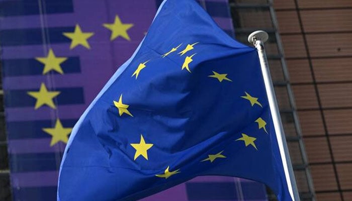 This photograph shows a European flag fluttering outside the EU Commission headquarters in Brussels. —AFP/File