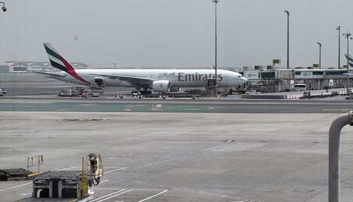 An Emirates airplane at Dubai International Airport, amid the U.S.-Israeli conflict with Iran, in Dubai, United Arab Emirates, March 8, 2026.—Reuters