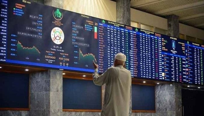 A broker is busy in trading at the Pakistan Stock Exchange in Karachi, October 17, 2024. — PPI