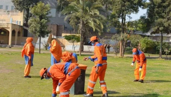 This representational image shows Rawalpindi Waste Management Company workers performing their duties. — Facebook@Rawalpindi Waste Management Company/File