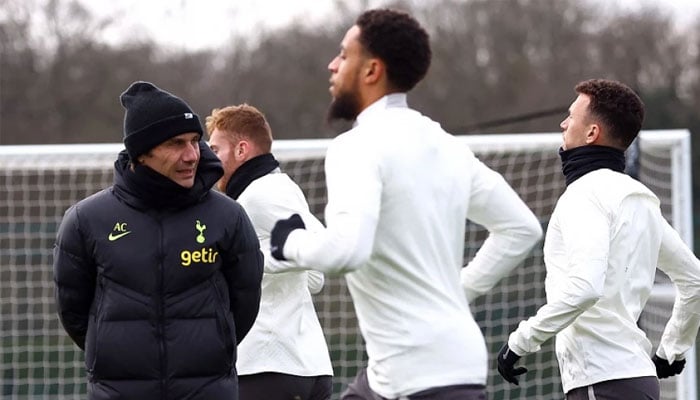 Tottenham Hotspur manager Antonio Conte, Arnaut Danjuma, Dejan Kulusevski and Ivan Perisic during training. —Reuters/File
