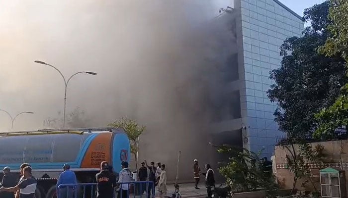 Smoke is seen after a fire broke out at a superstore near Zamzama Street in Clifton on March 30, 2026. — Facebook@ Geo News English