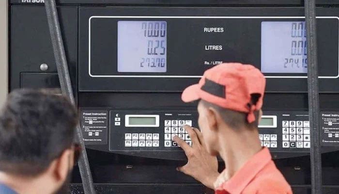 A representational image showing a worker at a fuel station. — AFP/File