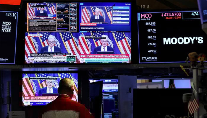Screens broadcasts a press conference by US Federal Reserve Chair Jerome Powell following the Fed rate cut announcement, on the floor of the New York Stock Exchange (NYSE) in New York City, US, October 29, 2025.—Reuters